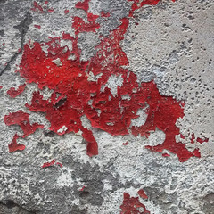Realistic texture of old plastered wall. The remnant of red paint on old grey plaster. Abstract cracked surface. Vector background.