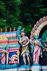Statue Hindu deities on the roof of temple within Batu Caves. Batu Caves - a complex of limestone caves in Kuala Lumpur, Malesia