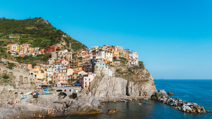 Fototapeta na wymiar Beautiful colorful cityscape on the mountains over Mediterranean sea, Europe, Cinque Terre, traditional Italian architecture