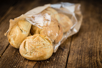 Wooden table with German Rolls, selective focus