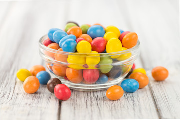 Portion of Cocolate coated Peanuts (selective focus)
