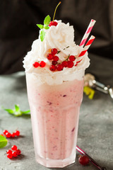 Berry milkshake decorated with red currant