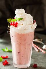 Berry milkshake decorated with red currant