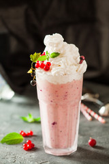 Berry milkshake decorated with red currant