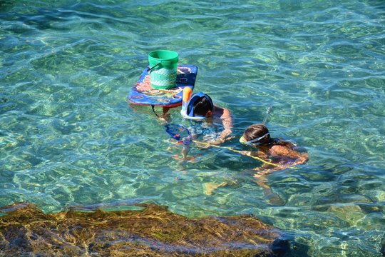 Playing in water, in Elba island
