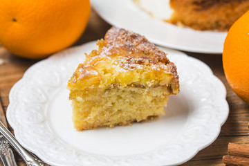 Orange cake on the wooden background