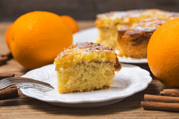 Orange cake on the wooden background