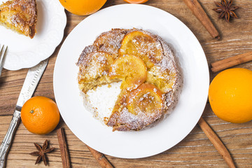 Orange cake on the wooden background