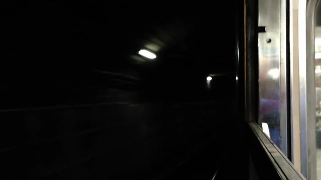 Subway moving through tunnel POV - side - train / carriage reference.
