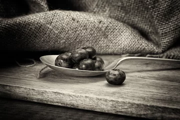 Foto op Plexiglas Blueberries and spoon on a rustic background © Christopher Hall
