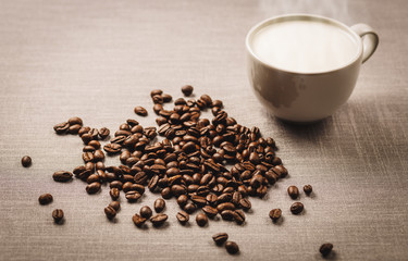 coffee and coffee bean on gray cloth background