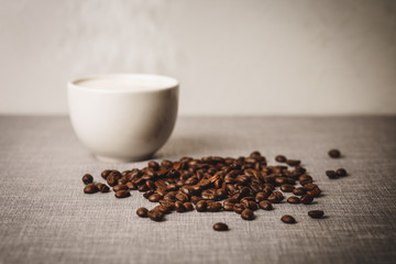 coffee and coffee bean on gray cloth background