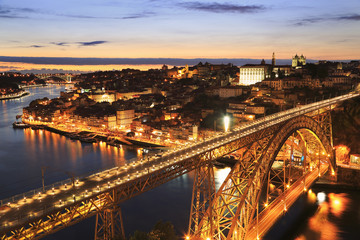 Fototapeta na wymiar Porto skyline and Douro River at night with Dom Luis I Bridge on the foreground, Portugal