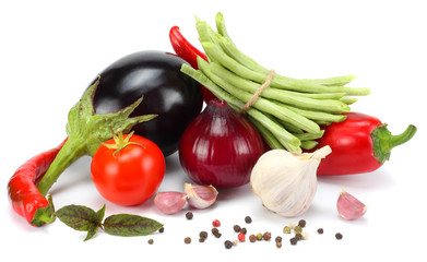 Assortment of fresh raw vegetables isolated on white background. Tomato, eggplant, onion, chili pepper, garlic, spices.
