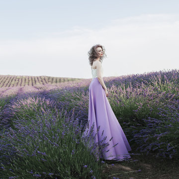 Artistic photo of a young woman in lavender