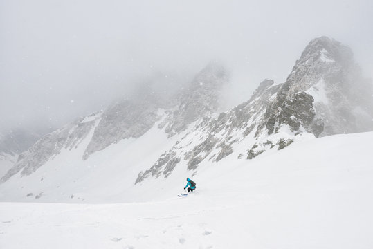 Skier off piste on a foggy day