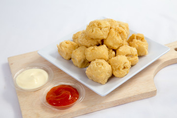 Deep fried crispy crisp tofu breaded with corn flake crumbs flour