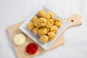 Deep fried crispy crisp tofu breaded with corn flake crumbs flour