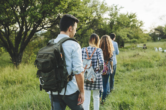 Group of friends walking in nature