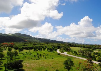 Scenic landscaped gardens and golf course with Mt. Tapochao in the side. Saipan, Northern Mariana Islands