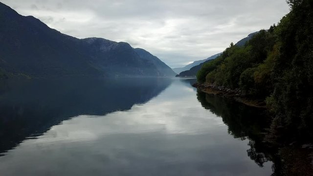 Norway - ideal fjord reflection in clear water from drone on air