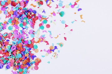 Confetti on white background with copy space