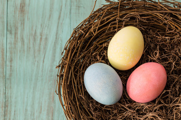 Three Colorful Easter Eggs In A Nest