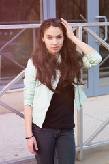 Portrait of young brunette outdoors