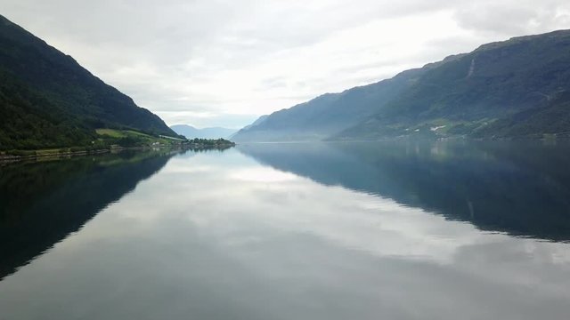 Norway - ideal fjord reflection in clear water from drone on air