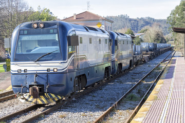 Railway transporting iron coils from a steel mill.