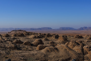 Fototapeta na wymiar Red rocks and sand desert in Jordan