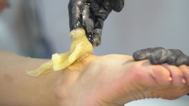 The girl is pulled out of her legs with shugar for shugaring