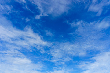 Naklejka na ściany i meble Nature background.Soft cloud in the blue sky on a sunny day.