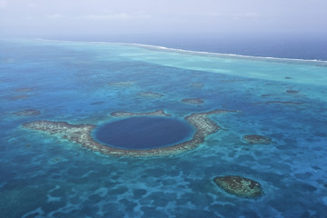 Aerial view of coral reefs and the Blue Hole, Lighthouse Atoll, Belize © Enrique