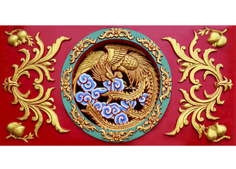 Close up carved phoenix on the wall sculpture in Chinese temple