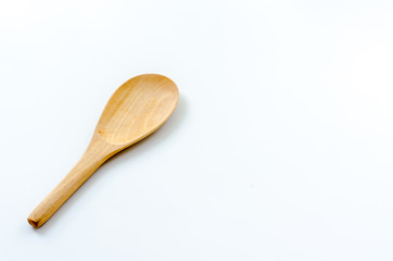 Old wooden ladle on the white background