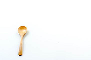 Wooden spoon on the white background