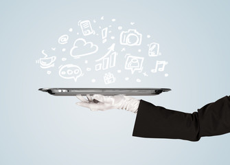 Waiter holding tray with media icons