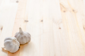 Garlic on wooden table background