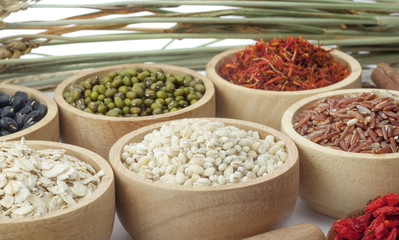 Cereal grains , seeds, beans on wooden background