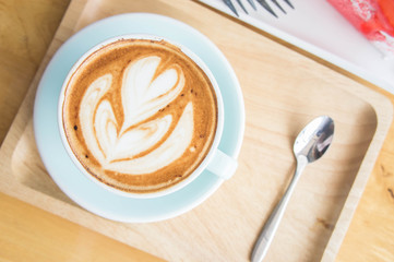 coffee heart cup on wood table in coffe shop cafe