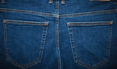 The texture of the jeans pockets is rear view. Fashion clothes.