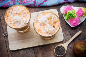 thai tea milkshake beverage thailand style and dessert on wood table