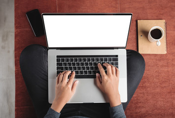 Fototapeta premium top view person using laptop computer on sofa inside home