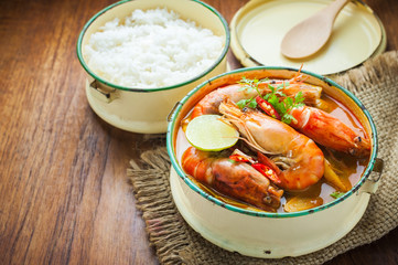 Thai food, River prawn spicy soup or tom yum goong on wooden table