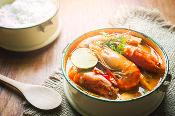 Thai food, River prawn spicy soup or tom yum goong on wooden table