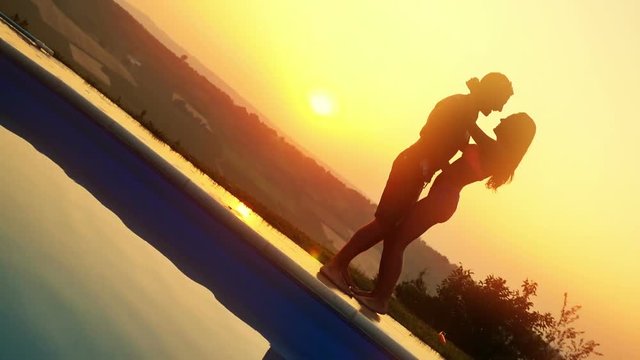 Couple dancing during sunset