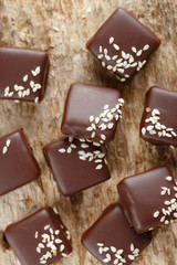 Handmade chocolate candies with sesame seeds