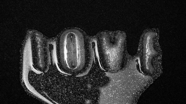 The word Love is formed from water into ice letters, melting reverse, 4k footage, Timelapse