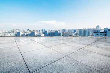 Fototapeta premium cityscape and skyline of hangzhou from empty brick floor